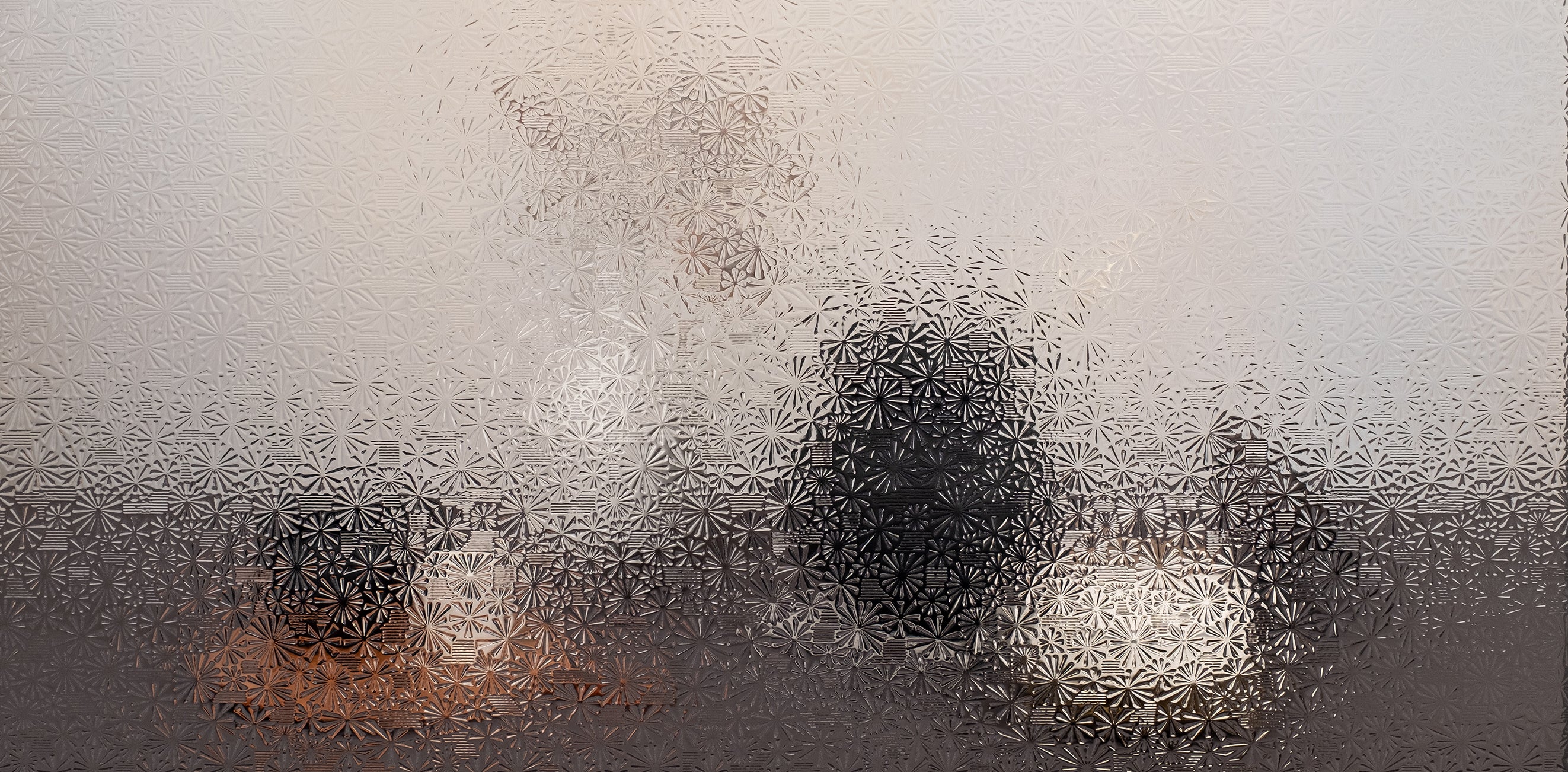 An image of a still life setting, obscured by the Starburst window film in order to exhibit the privacy level of the selected film.